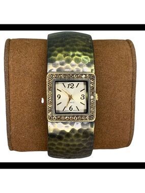 QUARTZ gold tone bangle clamper watch
